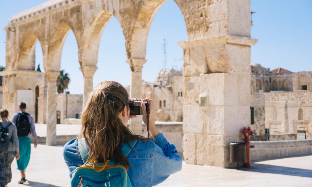 Woman taking pictures of ruins